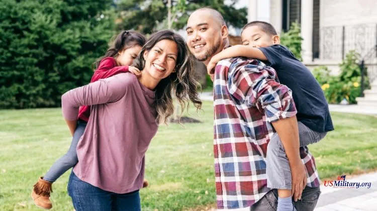 family of four smiling