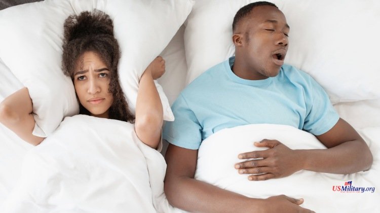 couple in bed dealing with sleep apnea partner