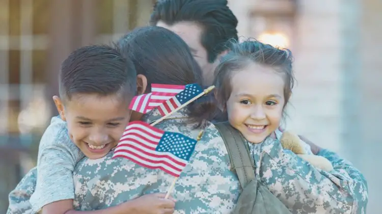 military family hugging