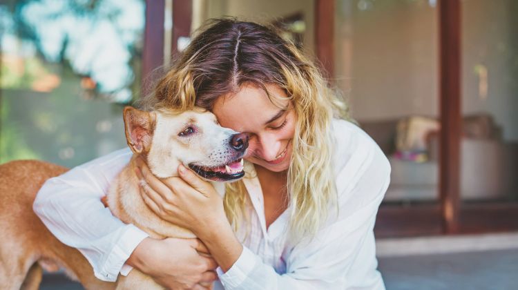 Woman hugging dog