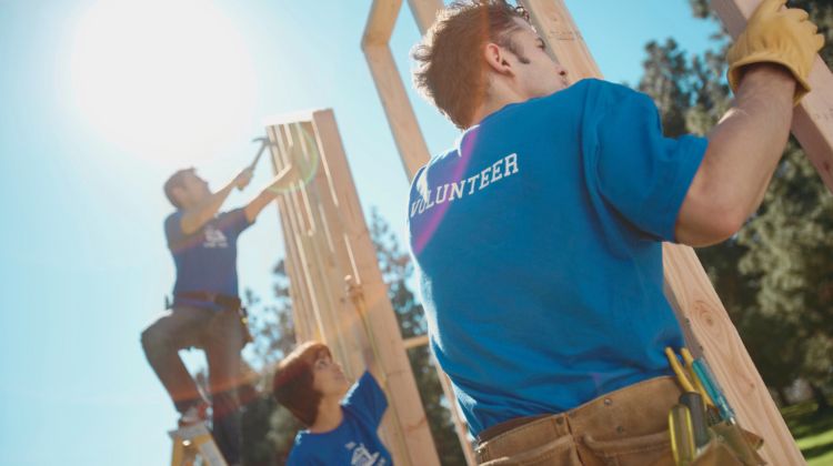 volunteers working on a home