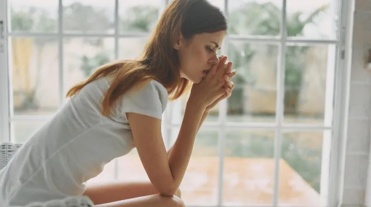 sad woman wearing white