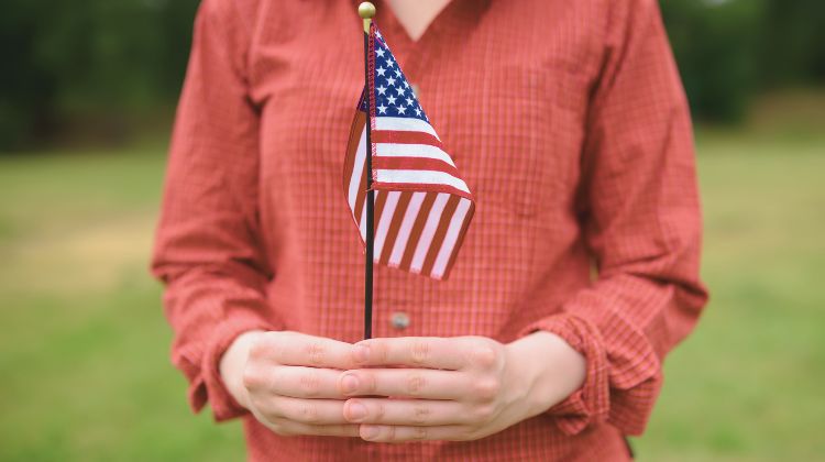 woman holding US flag