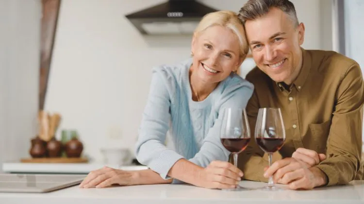 couple drinking wine in kitchen