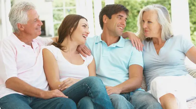 grown children sitting with parents