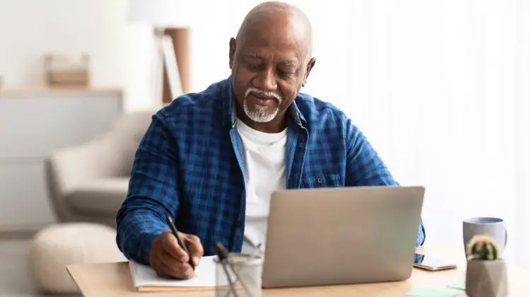 man doing research on laptop