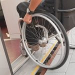 person using accessible door to enter home