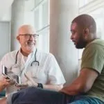 medical staff talking to patient