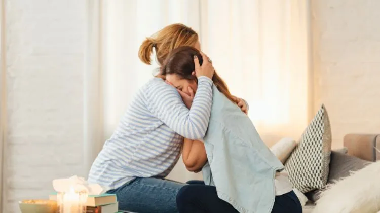 mother and daughter sad