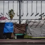 a group of tents sitting on top of a sidewalk