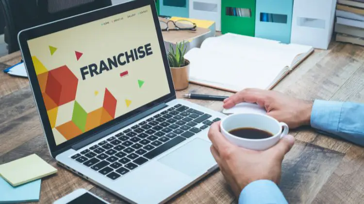 person researching franchise at desk