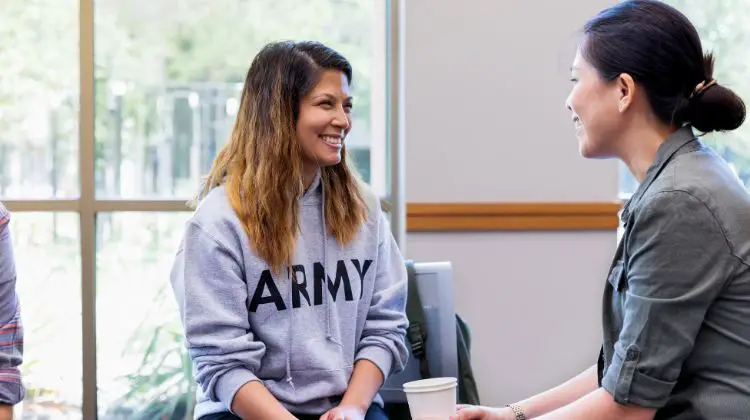 female veteran talking with another woman