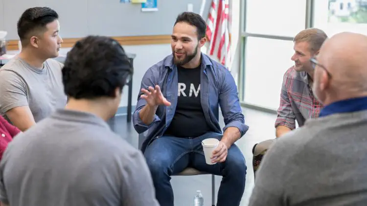 Veterans sitting in a circle talking