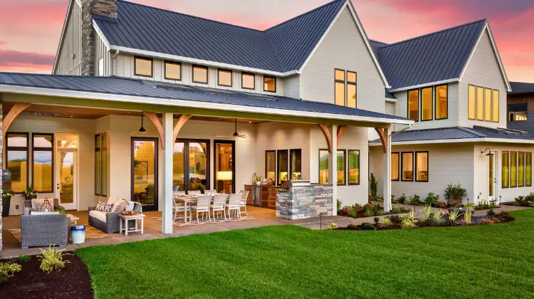 back porch of a large home at sunset