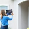 woman performing home appraisal