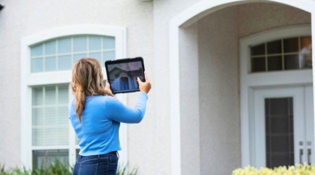 woman performing home appraisal
