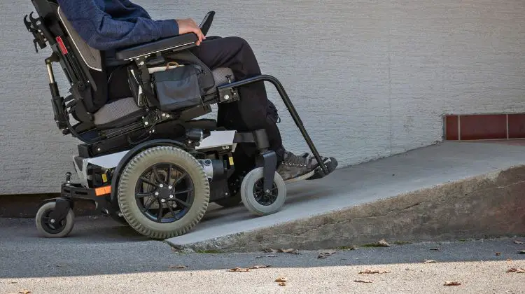 person using wheelchair ramp