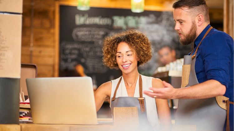 small business team looking at a laptop